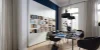 Soggiorno moderno con elegante libreria, tavolo e sedie, in stile Nolte Living.