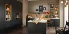 Cucina moderna con armadi scuri e isola centrale di Nolte Kitchen.