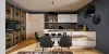 Cucina moderna con tavolo e sedie nere, eleganti armadi e decorazioni di Nolte Kitchen.