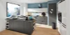 Cucina moderna con isola e armadi grigi in ambiente luminoso, Nolte Kitchen.