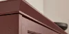 Armadio da cucina con superficie marrone e struttura in legno, parte di Nolte Kitchen.