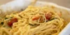 Un piatto di spaghetti e pomodori in un ambiente moderno di Nolte Kitchen.
