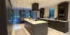 Cucina moderna con isola e mobili scuri, zona pranzo sullo sfondo. Nolte Kitchen.