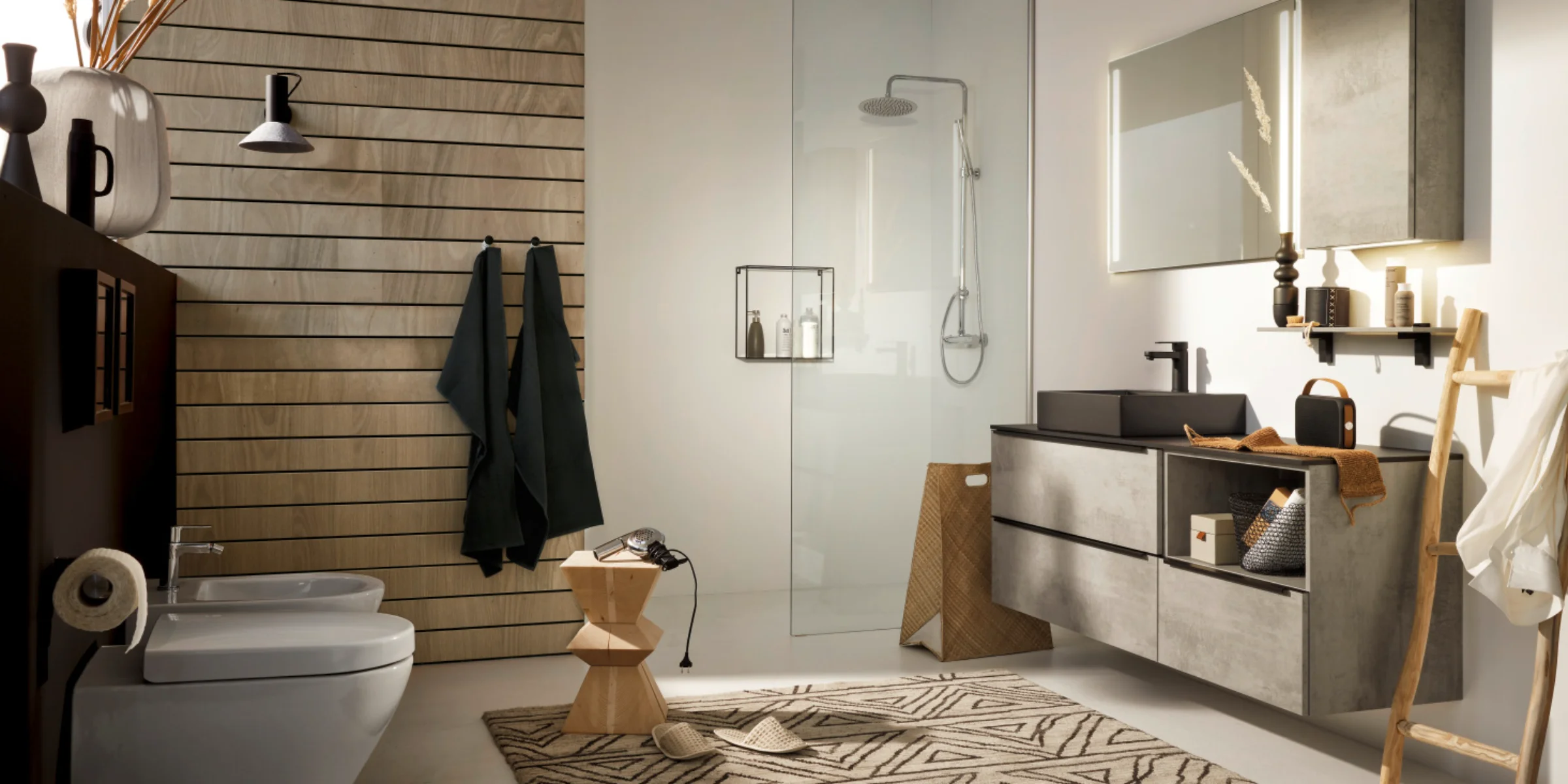 Modern bathroom with shower and sink by Nolte SPA.