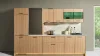 Cuisine moderne avec façades en bois, plan de travail éclairé, appareils et accents verts. Express Küchen.