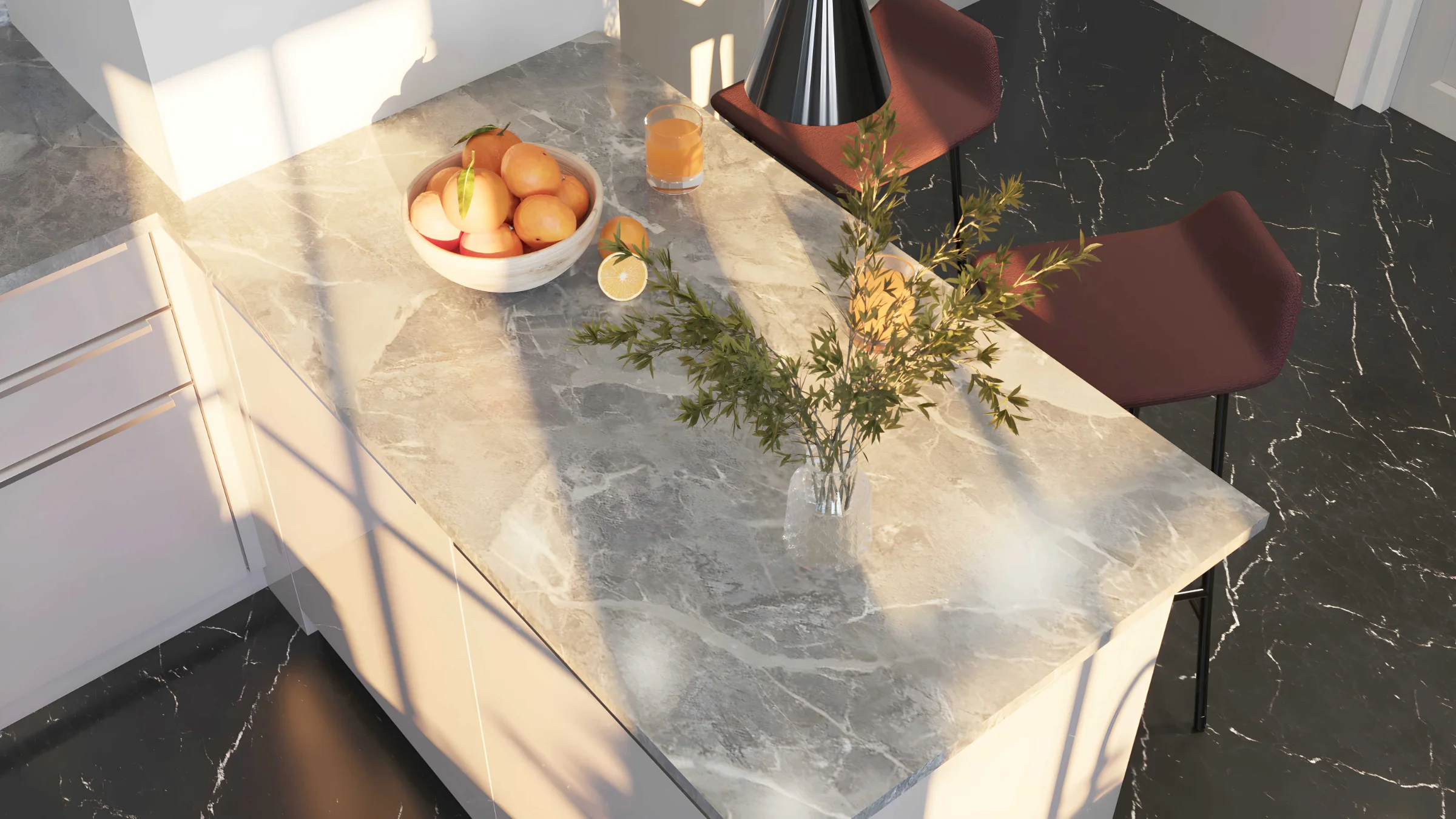 Cucina moderna con isola in marmo e frutta sul piano di lavoro di Nolte Kitchen.