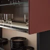 Open shelf with glasses and black plates in modern design, Nolte Living.