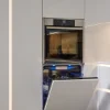 Cucina moderna con lavastoviglie aperta, design elegante di Nolte Kitchen.