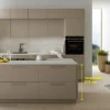 Cucina moderna con isola e ciotola di frutta, design di Nolte Kitchen.