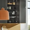 Cucina moderna con armadio aperto che mostra stoviglie e accessori in legno, Nolte Kitchen.