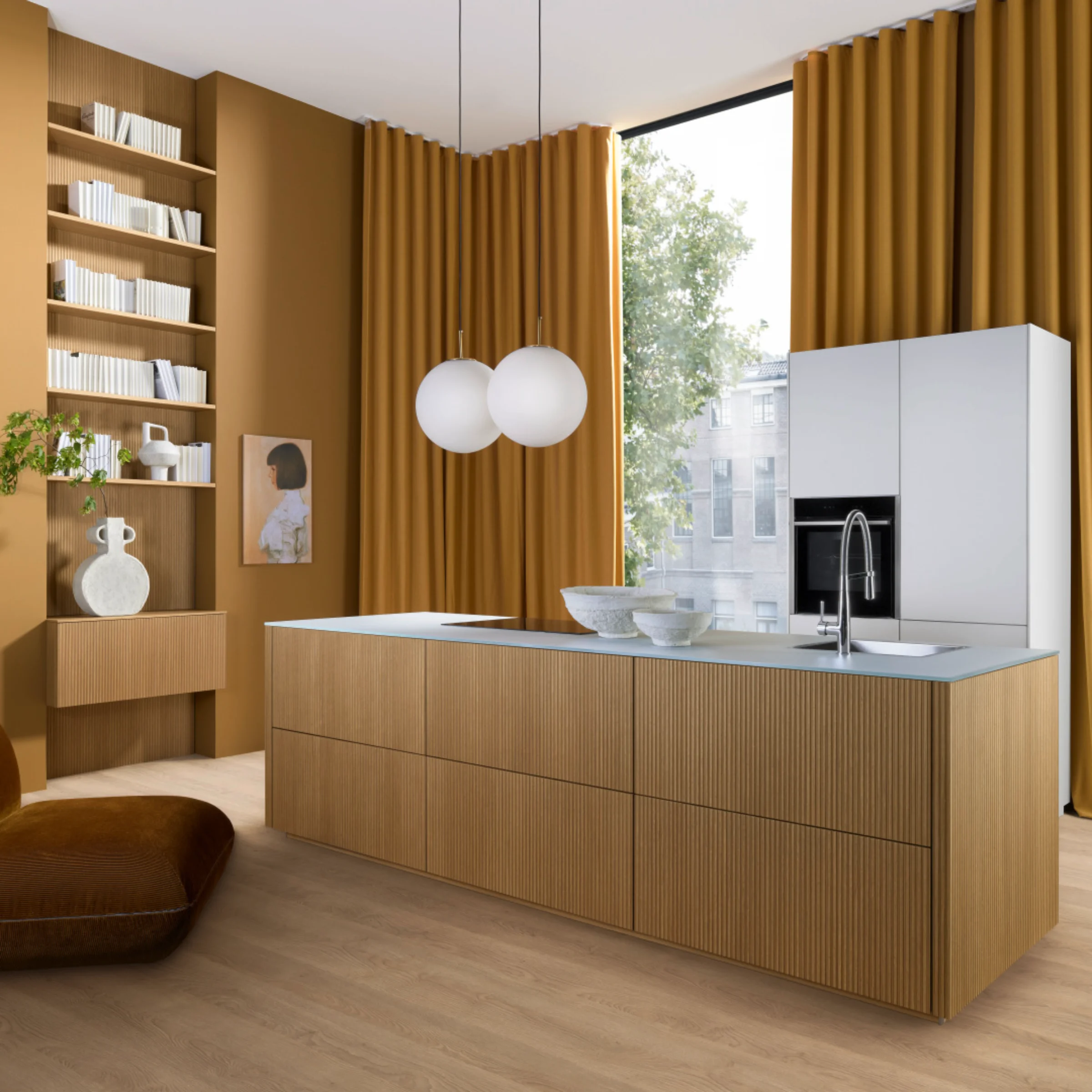 Nolte Kitchen: Cocina moderna con isla de madera, cortinas doradas y estanterías blancas.