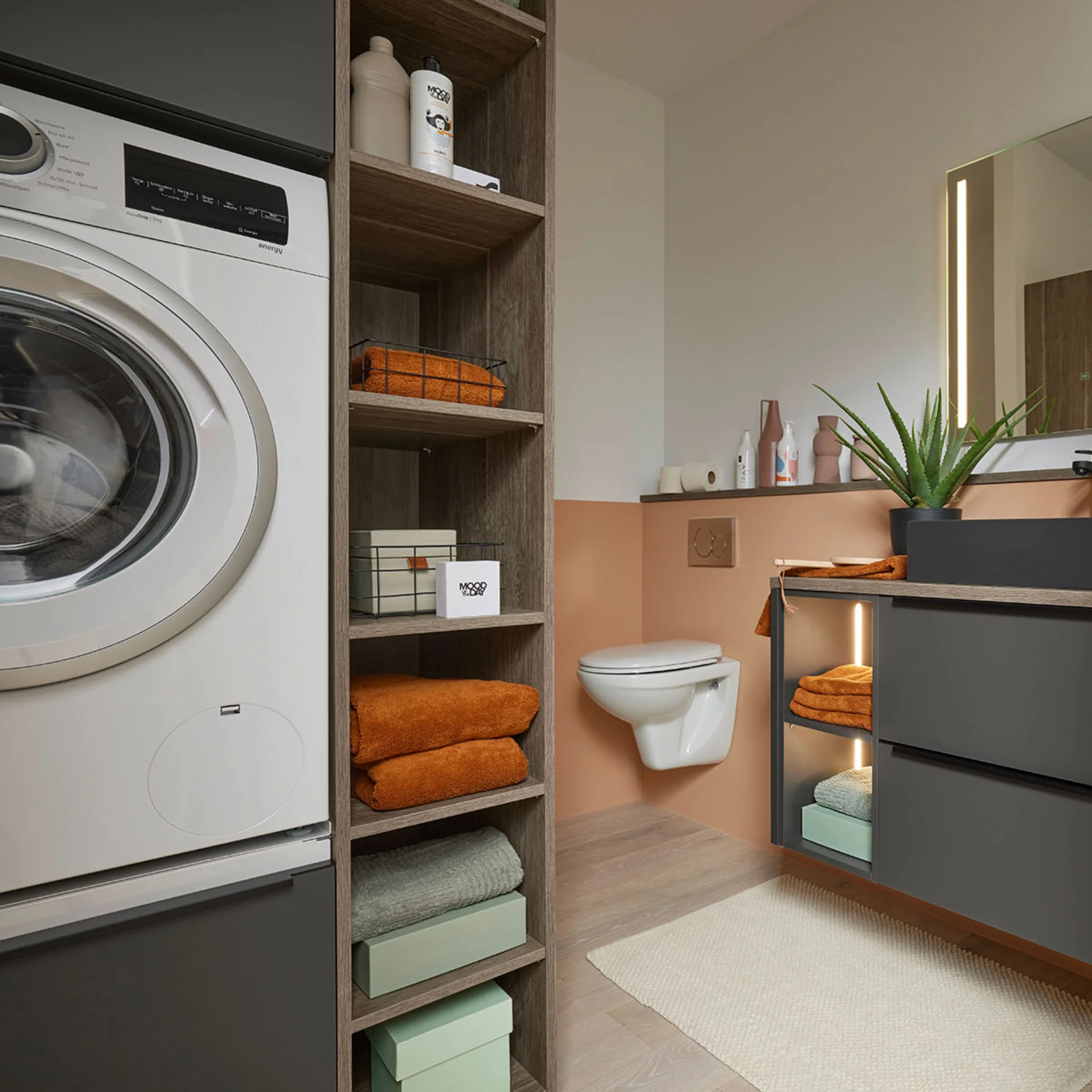 Modern bathroom with washing machine and sleek shelves, designed by Nolte SPA.