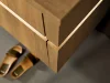 Mobile bagno in legno elegante con pantofole sul pavimento, Nolte SPA.
