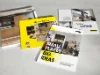 Quattro brochure su Nolte Kitchen, Nolte Living e NolteNeo design sono su un tavolo.